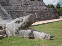 Kukulkan at the base of the west face of the northern stairway of El Castillo, Chichen Itza